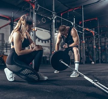 athletic-man-woman-with-dumbbells